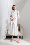 Woman wearing a white lace collared midi dress