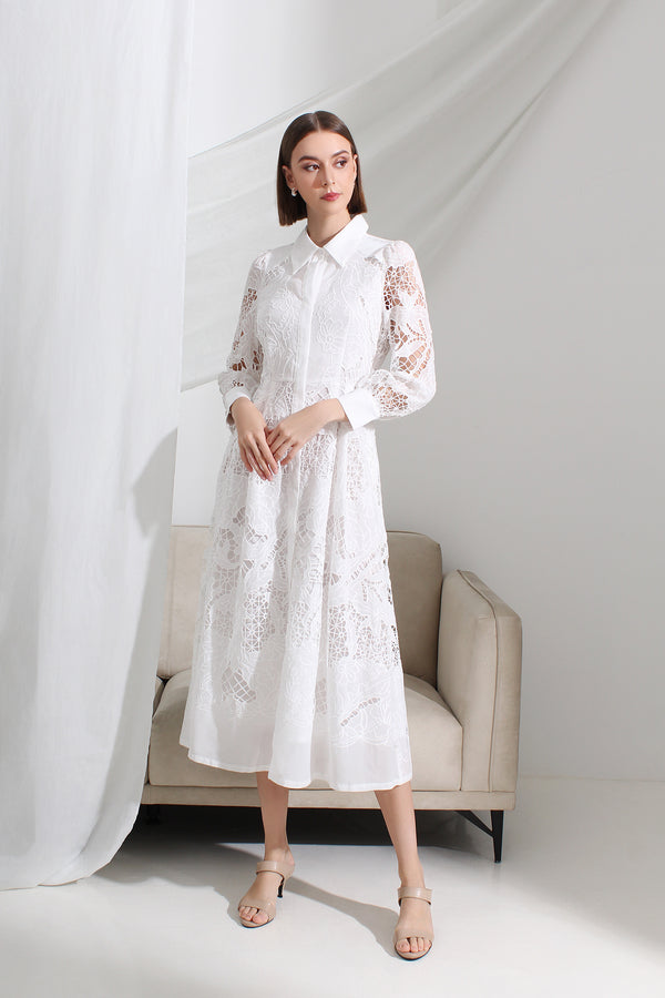 Woman wearing a white lace collared midi dress