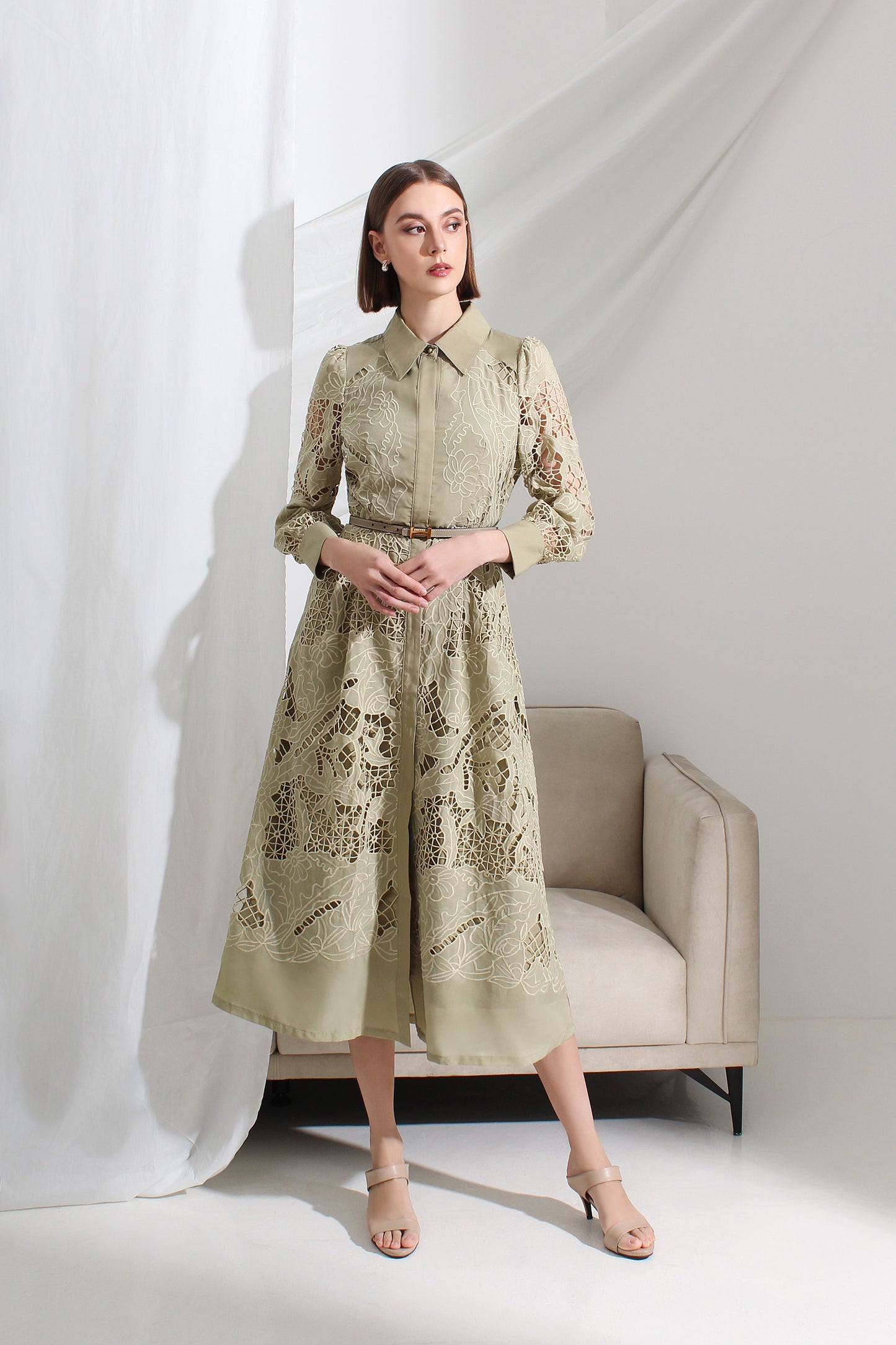 Woman wearing a light green lace dress at Le Ann Maxima