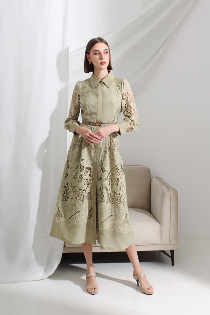 Woman wearing a light green lace dress at Le Ann Maxima