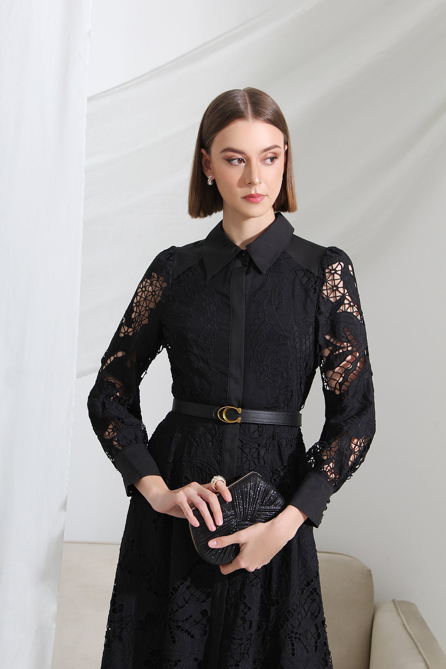 Woman wearing a black lace dress