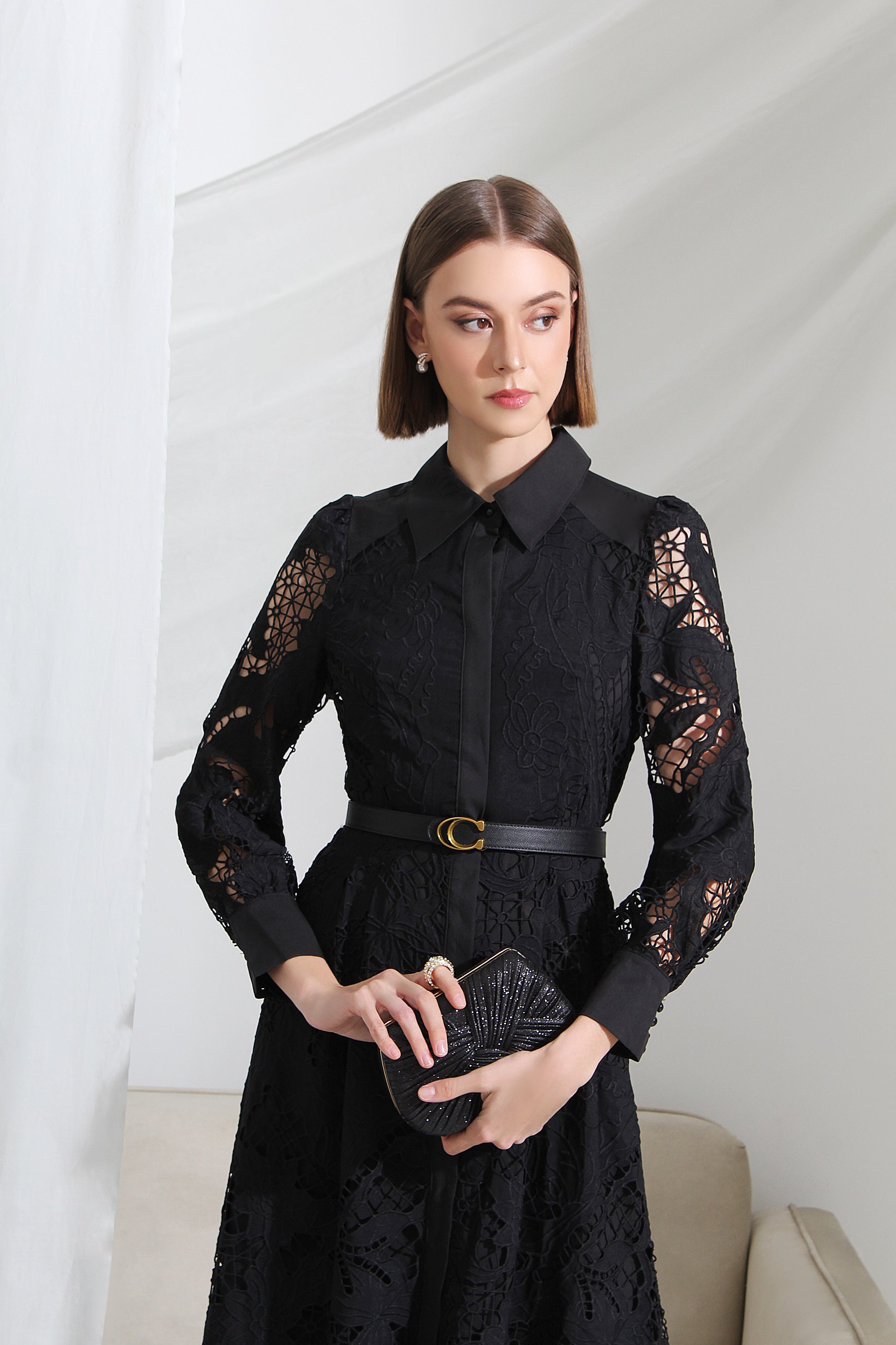 Woman wearing a black lace dress