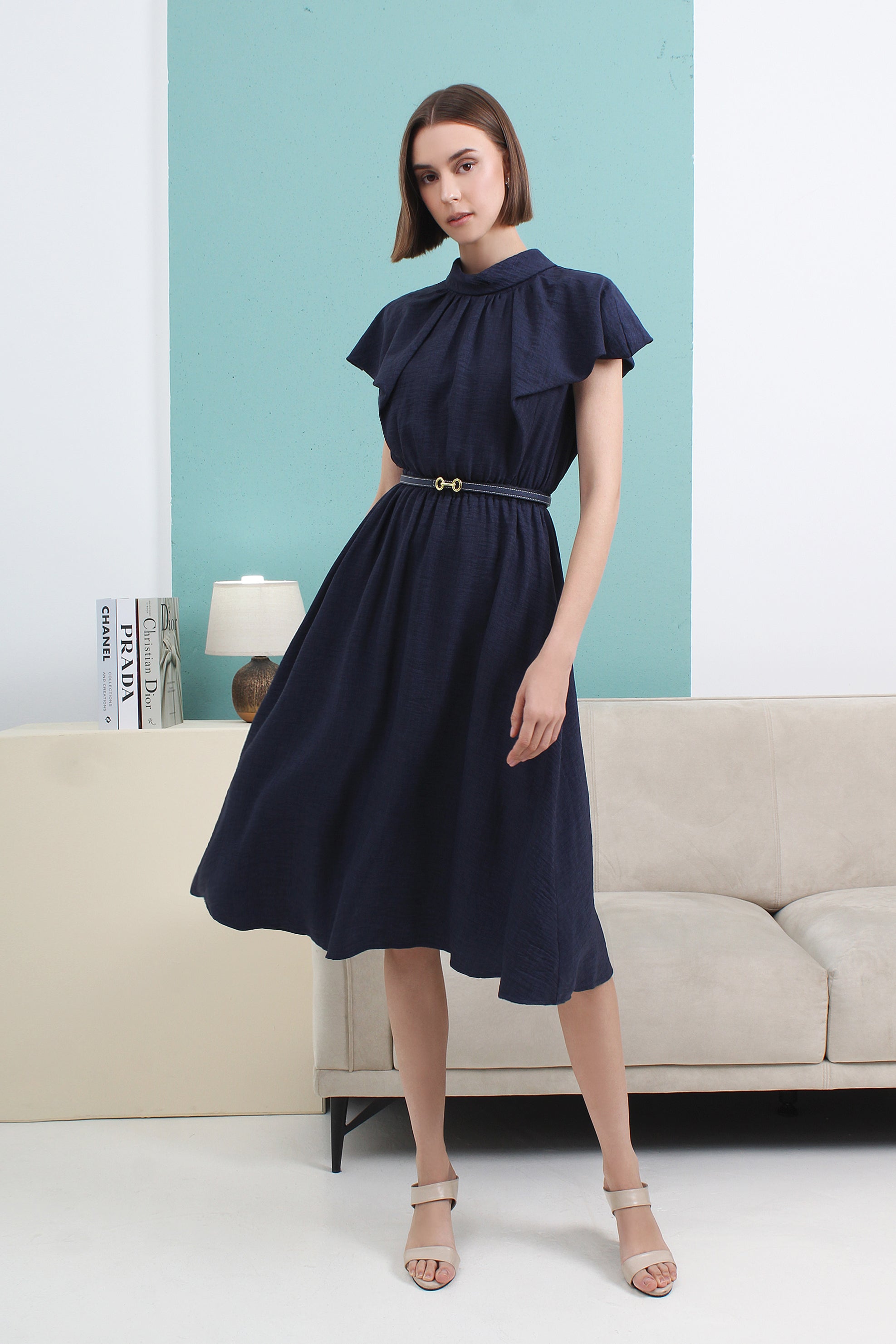 Woman wearing a navy blue dress