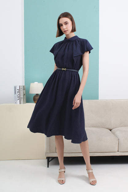 Woman wearing a navy blue dress