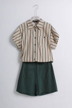 The set includes a short-sleeve button-front shirt in beige with dark green vertical stripes and a matching dark green pair of shorts with front patch pockets.
