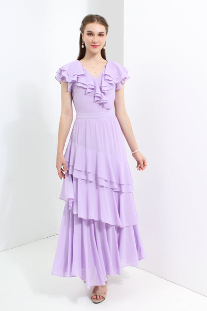 Woman wearing a purple dress with ruffled top and layered skirt