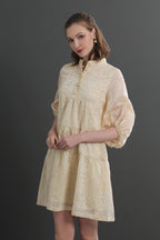 Woman wearing a light yellow dress