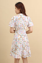 the back look of the purple floral printed mini dress with that has cotton eyelet and short puff sleeves