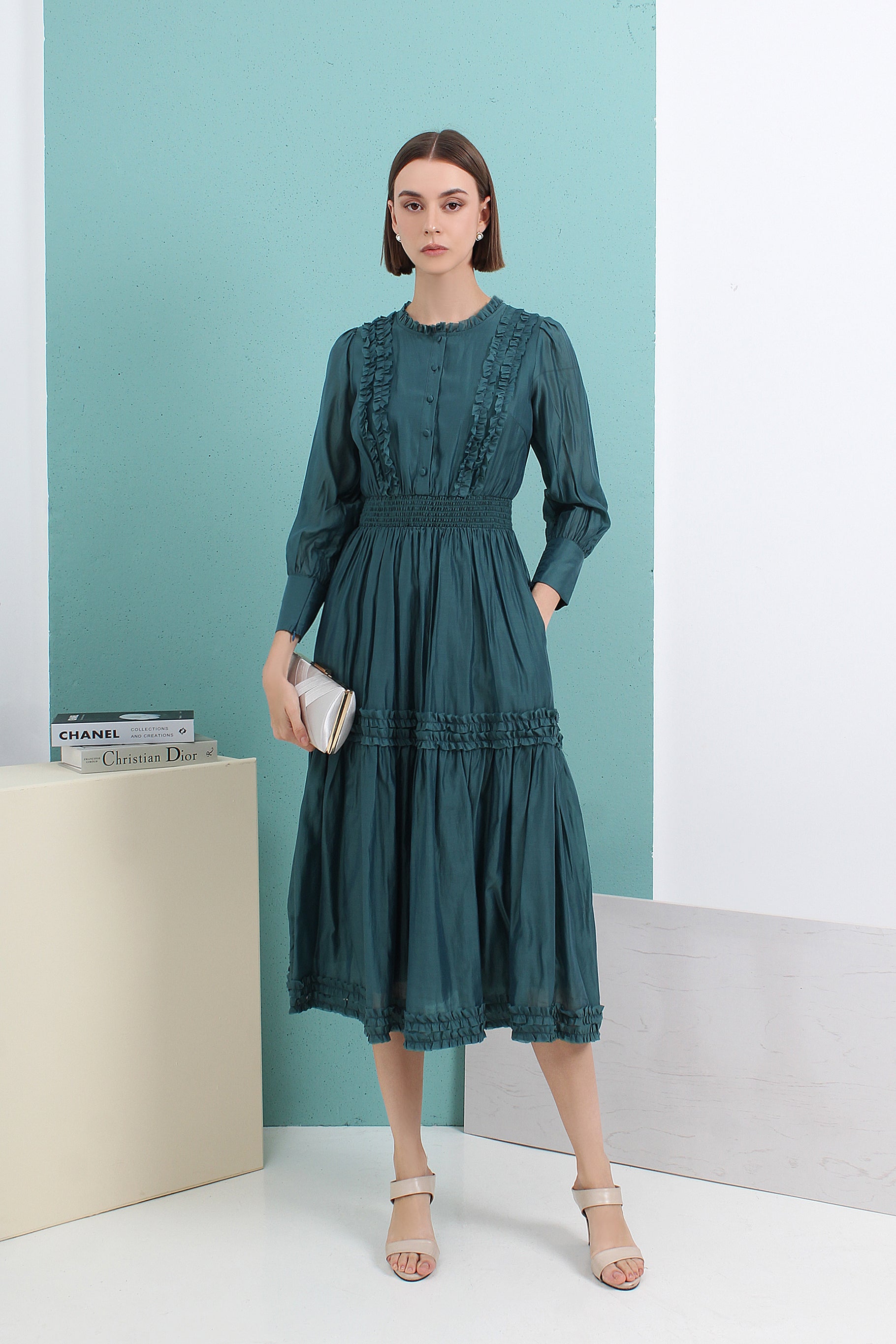 Woman wearing a green dress by le ann maxima malaysian local fashion brand