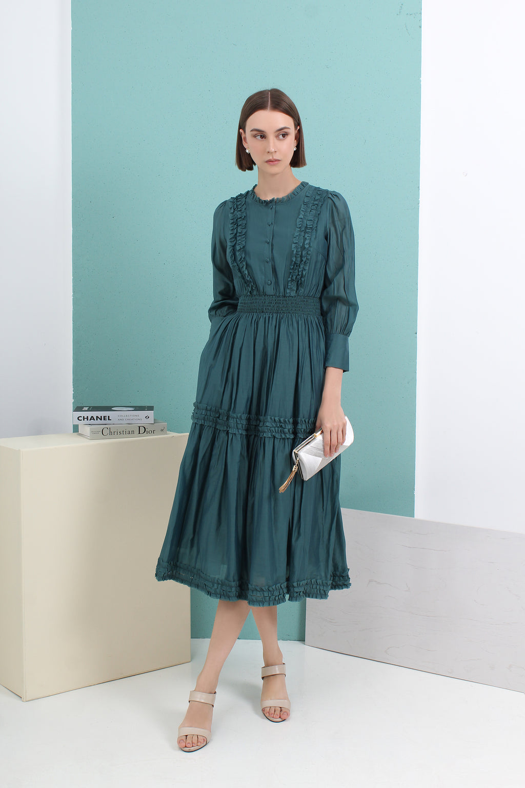 Woman wearing a green dress by le ann maxima malaysian local fashion brand