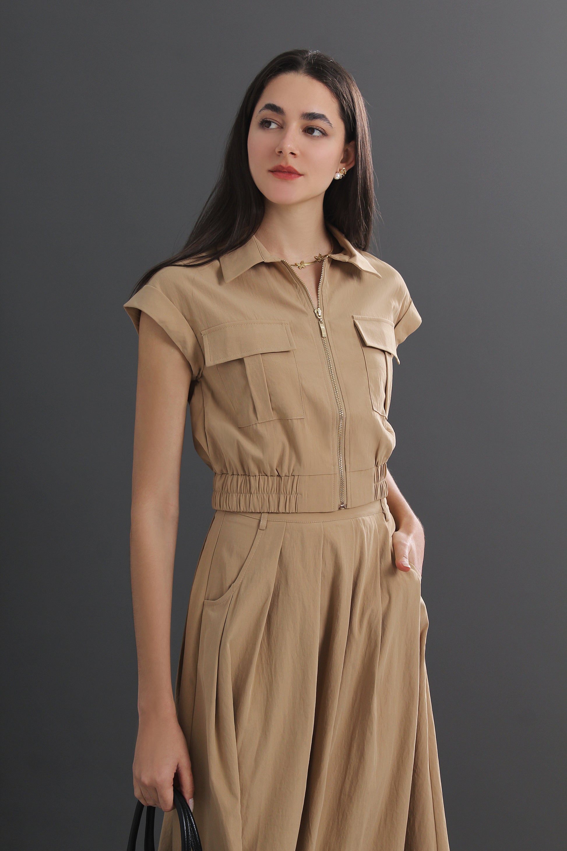 Woman wearing a beige two-piece set 12470118