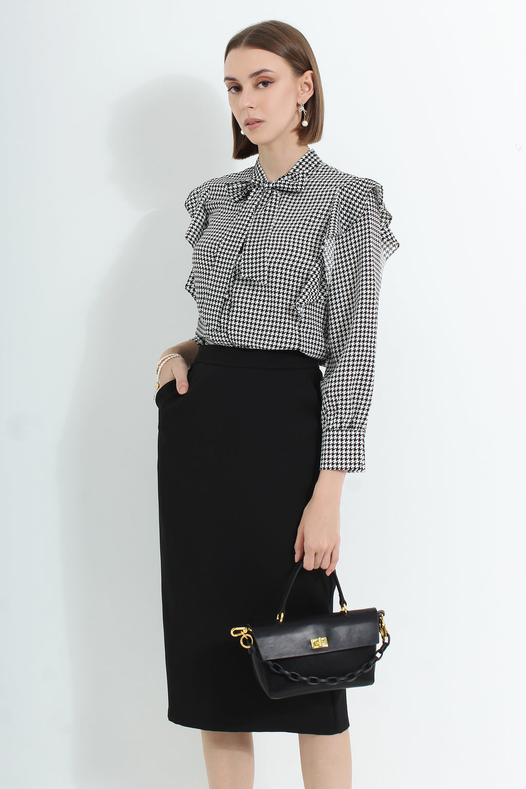Le Ann Maxima pencil midi skirt in black suiting fabric.