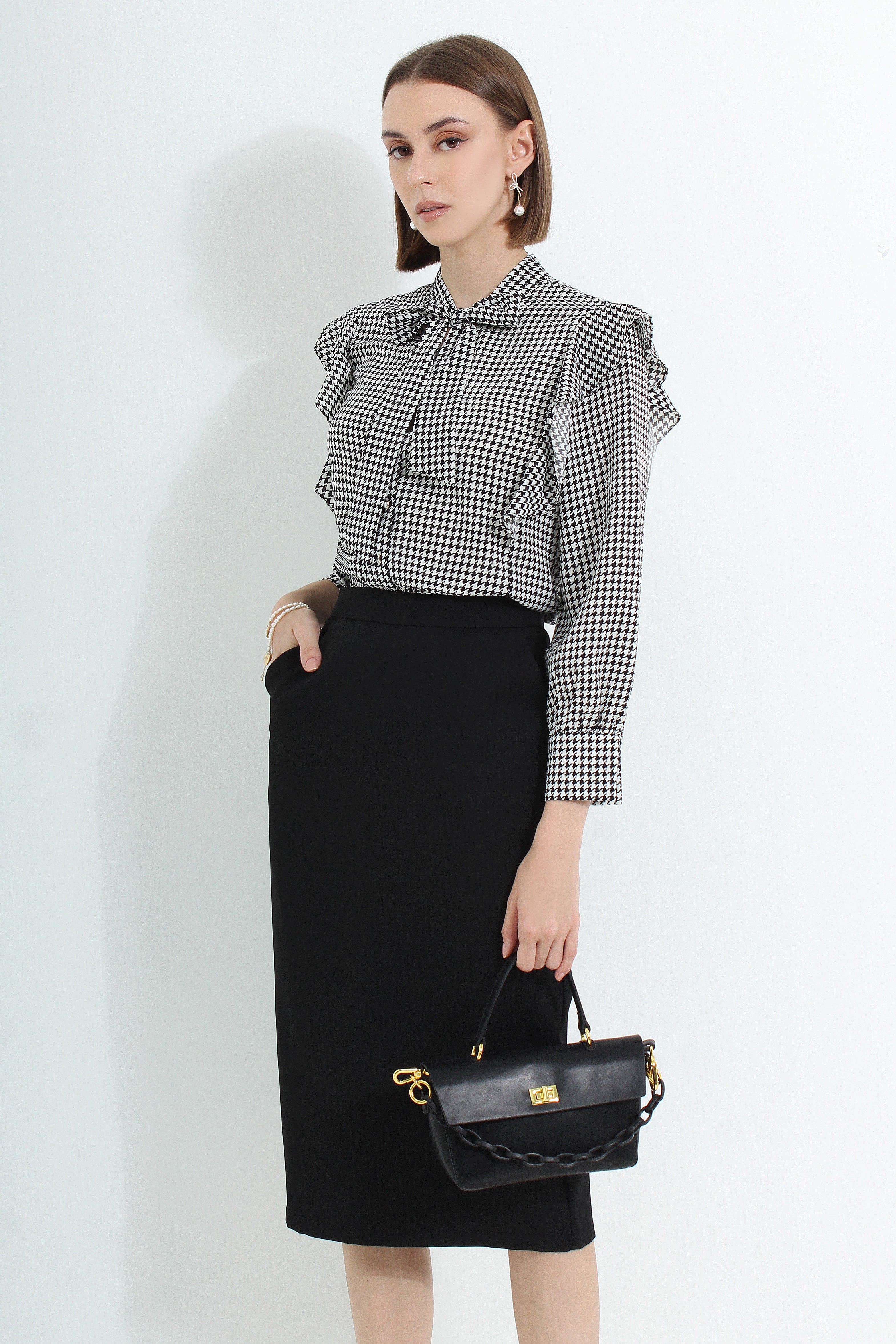 Le Ann Maxima pencil midi skirt in black suiting fabric.