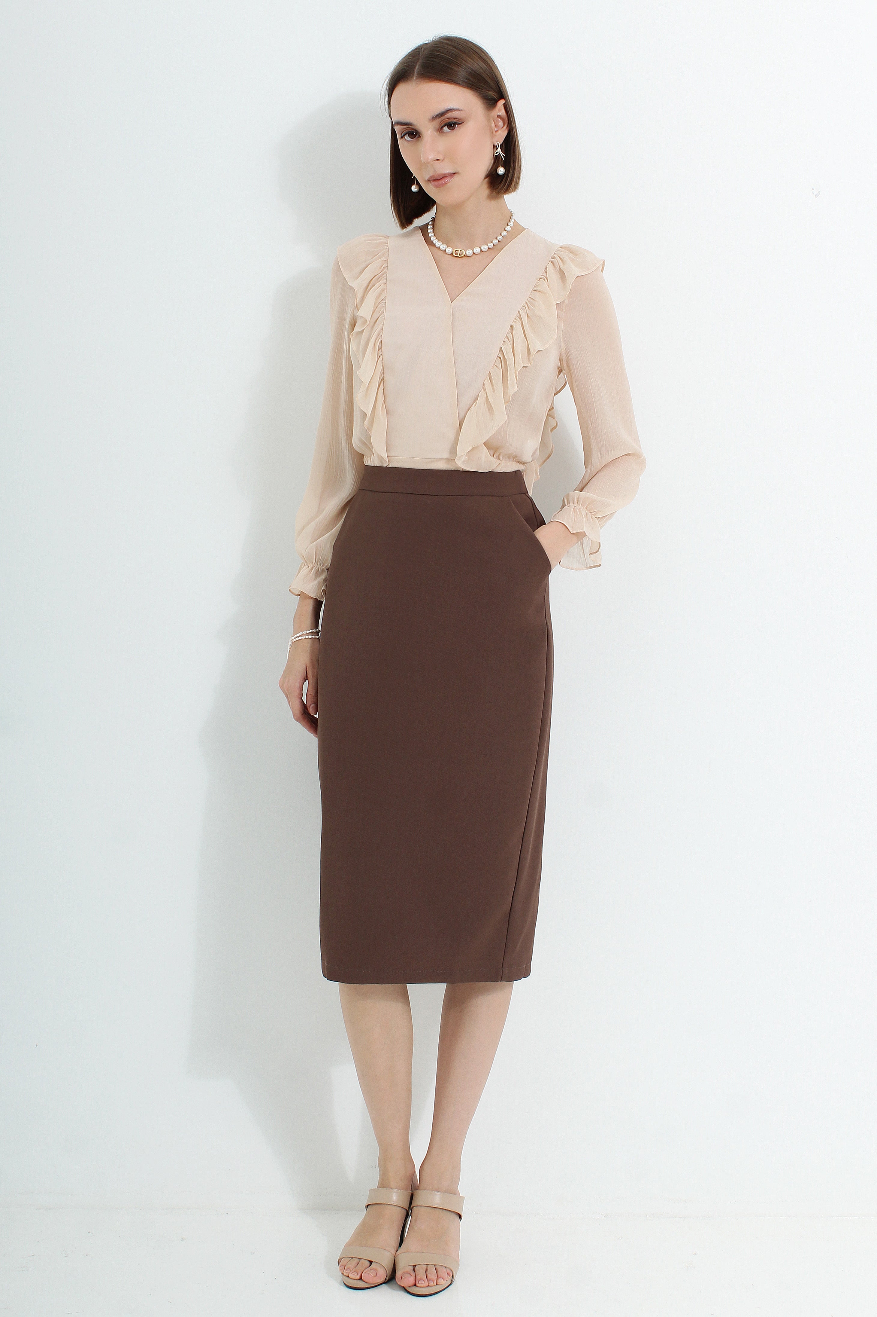 Le Ann Maxima pencil midi skirt in coffee suiting fabric.