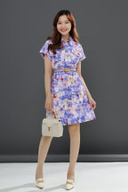 Le Ann Maxima lilac floral shirt dress with button-front closure and flap pockets.